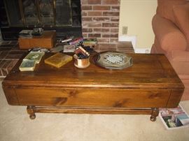 Coffee table with drop leaf