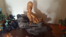 Carved Wooden Figure on Solid Rock