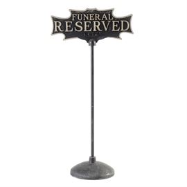 Vintage "Funeral Reserved" Cast Iron Parking Sign: A vintage cast iron parking sign, manufactured for a funeral home named “Lutz.” The sign reads “FUNERAL RESERVED” in large gray embossed letter on a Gothic-style plate to the upper section of the sign. The plate is mounted on a pole attached to a wide circular base.