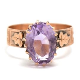 Antique 10K Rose Gold Amethyst Ring: An antique 10K rose gold ring featuring a prong-set amethyst.