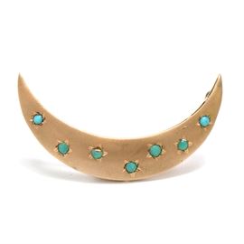 Victorian 14K Yellow Gold Turquoise Crescent Moon Brooch: A Victorian 14K yellow gold crescent moon brooch pin adorned with turquoise stones.
