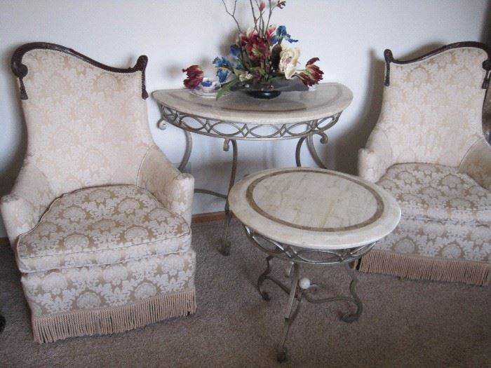 Parlor chairs. Marble topped tables.