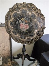 Tilt top table with mother of pearl inlay.  