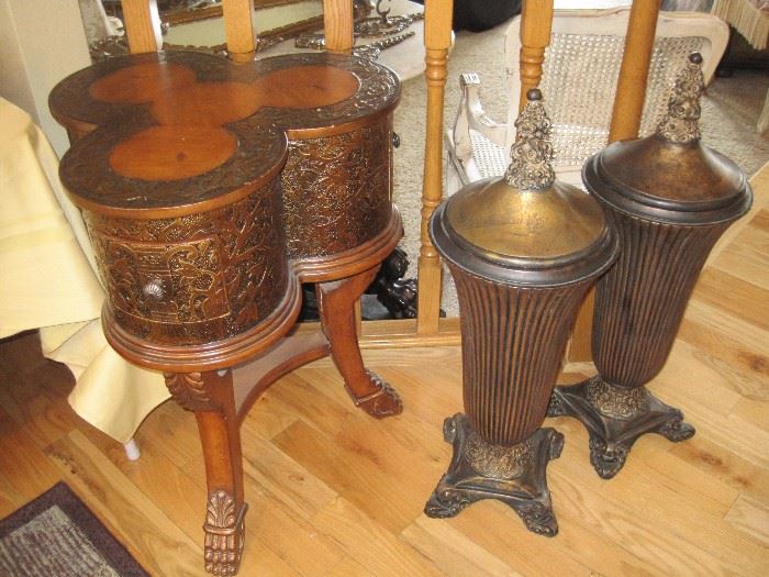 Covered urns and clover shaped side table.