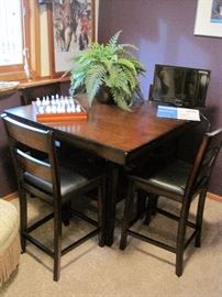 High top table with 4 chairs.