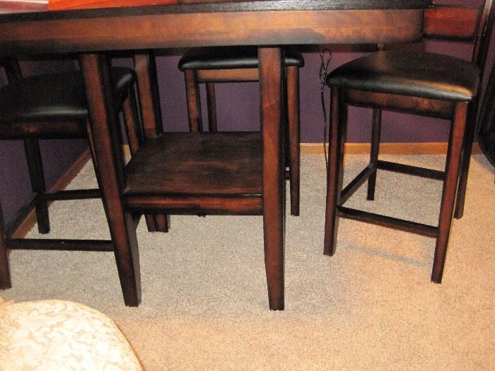 High top table with 4 chairs.
