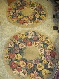 Floral hooked rugs.