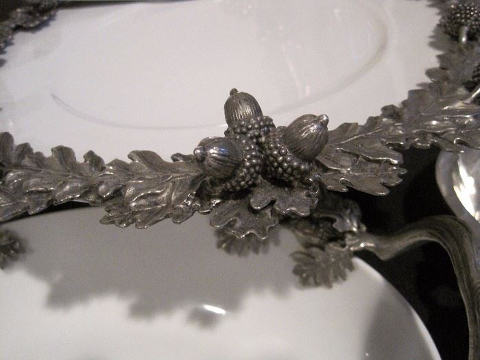 Pewter trimmed serving pieces.