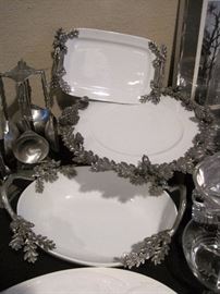 Pewter trimmed serving pieces.