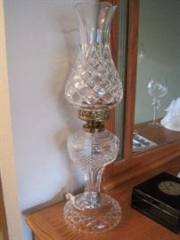 A pair of Waterford Hurricane Lamps.