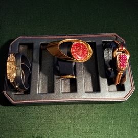 Left to right: Diamond wrist watch,  Gubelin "Lady G" 18k cuff style wrist watch (1970's), Ruby & diamond "Surprise" watch set in rose gold.