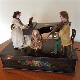 Fully functioning Automaton with woman "playing" piano, man "playing" violin & child dancing....all to a Strauss Waltz music box tune.  