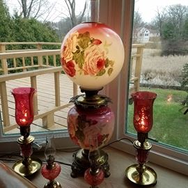 Vintage lighting including electrified Gone With The Wind lamp, etched cranberry boudoir lamps, and mini oil lamps 