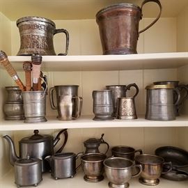 Pewter and other metals.  Some pewter mugs with age (19th century)