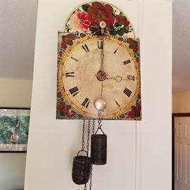Rare hand-painted clock. The pendulum is in front of the dial (it's hanging over the numeral "VI").  Time & strike 30 hour clock in working order.  Brass movement