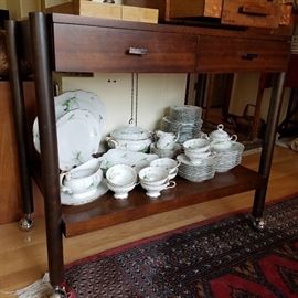 Mid-century server on casters.  Has two drawers for storage