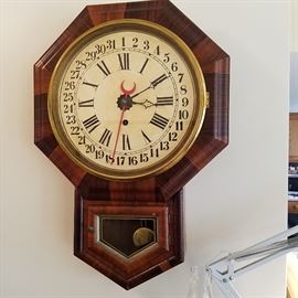 Ansonia rosewood veneer finish calendar clock.  8-day time only movement