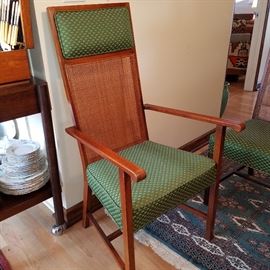 One of the two arm chairs with the dining set.  NOTE:  the other arm chair, and one of the side chairs have losses to the caning on the backs.