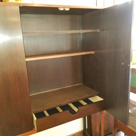 Inside the china cabinet.  A drawer on each side.  Some shelves added (not original?).  No label found.