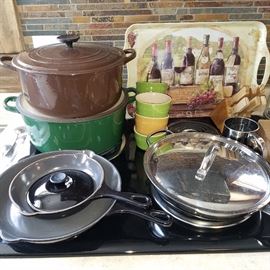 Le Creuset Dutch ovens, frying pans, and ramekins.