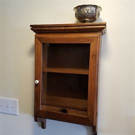 Hanging cabinet with interior lower drawer.  Silverplate bowl on top