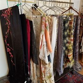 Rack of shawls, weavings, etc.