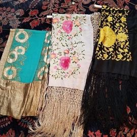 Three of the embroidered shawls. One on left with metallic thread.