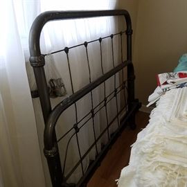 Full size iron bed, complete with side rails