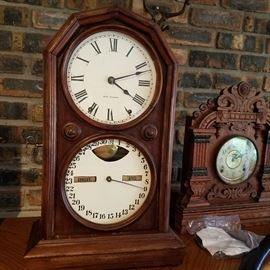 Left: Seth Thomas double dial calendar clock.  8-day time and bell strike. Running.  Right: Ornate oak shelf clock, not working.