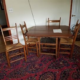 Table & Chair set.  Table top is hinged and lifts to create an armchair (table top becomes back of chair). Table is Ca. 1820 from Quebec, according to accompanying document.  Chairs are from a Canadian convent, Ca. 1860