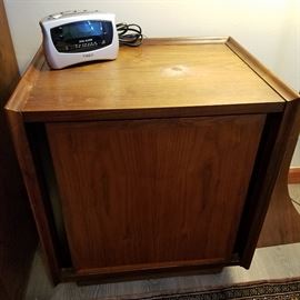 Dillingham stand with single door hiding one drawer.  Top has circular blemish.  Mid-Century.