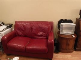 Well broken in leather loveseat that screams comfort