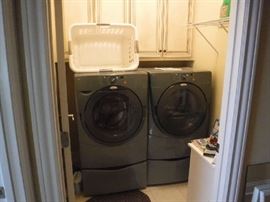 Whirlpool washer and dryer. I found out they are about 10 years old and works very well. With only 2 people using it there is a lot less wear and tear than a whole family would do.