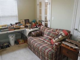 This smaller sofa opens into a bed