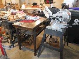 A fine wood working table with some age. I believe that was used to do the stain glass on. We also have a selection of clamps, stain glass pieces and scraps and more