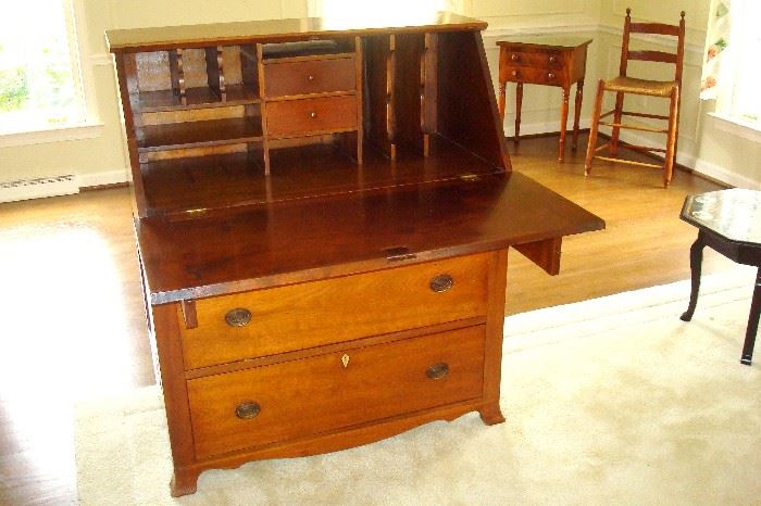 Same desk opened showing two drawers and cubby holes.