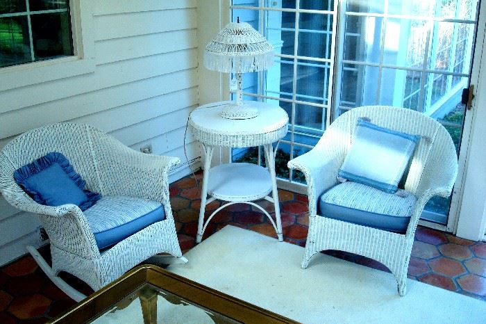 Antique wicker rocking chair, straight chair, lamp stand and lamp.