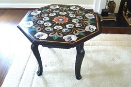Black lacquer center table with mother of pearl inlays.