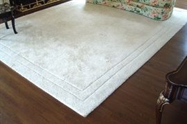 Room size wool white rug.