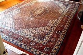 Oriental hand knotted room size rug.