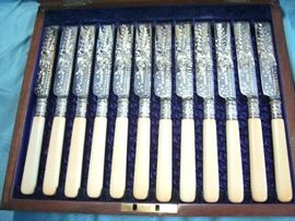 Set of engraved knives with bone handles.