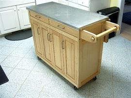 Drop leaf maple kitchen center cabinet on wheels.