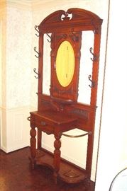 Victorian hall tree with umbrella holders and coat hooks. C-1890.