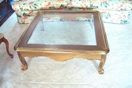 Brass and glass top coffee table.