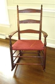 Antique, original Shaker rocking chair from the Shaker factory at Mt. Lebanon, New York.  Signed with the Shaker trademark used in 1873 with replaced seat.