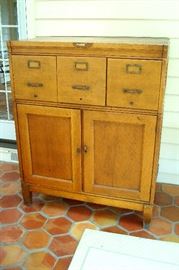 Antique oak file cabinet with doors and file drawers. Comes apart in four sections for easy transport.