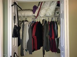 One of the many closets in the home - there are men's clothing size L, linens, some purses, scarves and other accessories.
