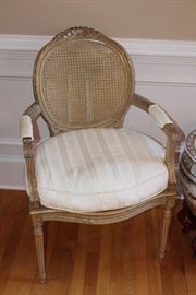 Detail of the caned, cushioned chair
