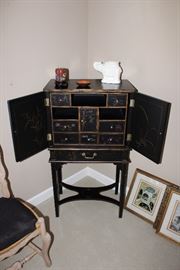 Expanded view of the vintage asian-themed cabinet on legs