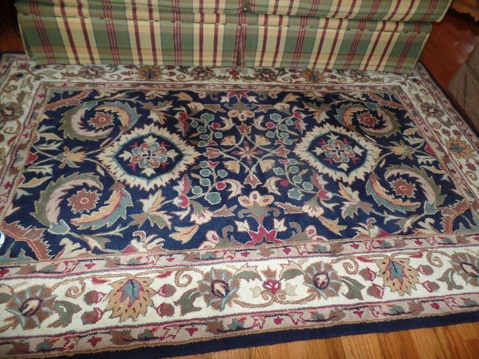 Area rug, 5' X 8'. Bright colors and in excellent condition.